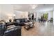 Open concept living room and dining area with tile flooring and neutral walls at 9636 Salford Isle St, Las Vegas, NV 89123