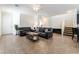Open living room with tile floors, neutral walls, and stairs to the second floor at 9636 Salford Isle St, Las Vegas, NV 89123