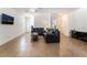Living room with tile flooring, neutral walls, and views into the dining area at 9636 Salford Isle St, Las Vegas, NV 89123