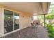 Charming covered patio with brick pavers and a view of the well-maintained backyard at 9636 Salford Isle St, Las Vegas, NV 89123