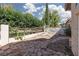Backyard with a stone patio area and decorative metal fence at 1709 Pacific Panorama Pl, Las Vegas, NV 89144