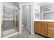 Bathroom with tile floors, glass shower, vanity with sink, and toilet at 1709 Pacific Panorama Pl, Las Vegas, NV 89144