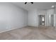 Empty bedroom with carpet, neutral walls, and sliding closet doors at 1709 Pacific Panorama Pl, Las Vegas, NV 89144
