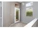 Welcoming entryway featuring tile floors, a decorative glass door, and ample natural light from clerestory and standard windows at 1709 Pacific Panorama Pl, Las Vegas, NV 89144