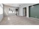 Spacious living room with neutral carpet, offering a bright and airy atmosphere with its large windows and natural light at 1709 Pacific Panorama Pl, Las Vegas, NV 89144