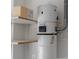 Close up of a Nutone central vac with shelving beside and electrical outlet near at 1709 Pacific Panorama Pl, Las Vegas, NV 89144