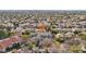 Expansive aerial view of a residential neighborhood showcasing a house with a tiled roof and a pool at 2338 Dolphin Ct, Henderson, NV 89074