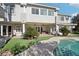 Backyard featuring an outdoor patio, artificial grass and a refreshing pool, ideal for relaxation and entertainment at 2338 Dolphin Ct, Henderson, NV 89074