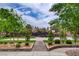 Paver path leads to a community basketball court, surrounded by trees and landscaping at 2338 Dolphin Ct, Henderson, NV 89074