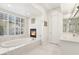 Luxurious bathroom with soaking tub, fireplace, and marble surround at 2338 Dolphin Ct, Henderson, NV 89074