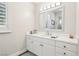 Bright bathroom features white cabinets and countertop, with an oversized mirror at 2338 Dolphin Ct, Henderson, NV 89074