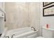 Inviting bathroom with bathtub, tiled walls, and elegant fixtures at 2338 Dolphin Ct, Henderson, NV 89074