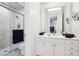 Bright bathroom with a glass enclosed shower and a modern white vanity with ample storage at 2338 Dolphin Ct, Henderson, NV 89074
