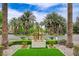 Community entrance featuring manicured landscaping and palm trees, creating a welcoming atmosphere at 2338 Dolphin Ct, Henderson, NV 89074