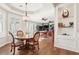 Open concept dining and living areas feature hardwood floors and plantation shutters at 2338 Dolphin Ct, Henderson, NV 89074
