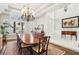 Bright dining room with a large window and spacious table, ideal for Gathering meals and entertaining guests at 2338 Dolphin Ct, Henderson, NV 89074
