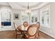 Elegant dining room with hardwood floors, natural light, and a classic chandelier at 2338 Dolphin Ct, Henderson, NV 89074
