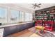 Spacious home office featuring custom built-in bookshelves and cabinetry with a sunny window at 2338 Dolphin Ct, Henderson, NV 89074
