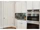 Close-up of kitchen features including a built-in oven and custom cabinets at 2338 Dolphin Ct, Henderson, NV 89074
