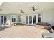 Covered patio featuring tiled floors and comfortable seating, perfect for relaxing outdoors at 2338 Dolphin Ct, Henderson, NV 89074