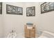 Cozy powder room with decorative wall art and modern fixtures at 2338 Dolphin Ct, Henderson, NV 89074