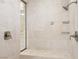 Beautiful marble walk-in shower featuring sleek fixtures and tiling at 2338 Dolphin Ct, Henderson, NV 89074