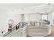 Elegant staircase with decorative iron railing and hardwood floors at 2338 Dolphin Ct, Henderson, NV 89074