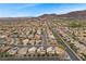 Expansive aerial showcasing a community near mountains, highlighting desert landscaping at 283 Grand Olympia Dr, Henderson, NV 89012