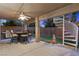 Inviting backyard with a patio, a built-in grill, spiral staircase, and mini-golf green at 283 Grand Olympia Dr, Henderson, NV 89012