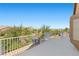 Wide view of a balcony overlooking neighborhood trees and blue skies at 283 Grand Olympia Dr, Henderson, NV 89012