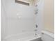 Bright white tiled bathroom with white bathtub at 283 Grand Olympia Dr, Henderson, NV 89012