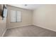 Bedroom with neutral walls, carpet, and a window with blinds at 283 Grand Olympia Dr, Henderson, NV 89012