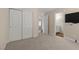 Bedroom featuring carpet, neutral walls, and closet access at 283 Grand Olympia Dr, Henderson, NV 89012