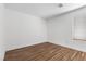 Simple bedroom with wood-look tile and window. An empty canvas at 283 Grand Olympia Dr, Henderson, NV 89012