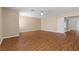 Bedroom with wood flooring, ceiling fan, and walk-in closet at 283 Grand Olympia Dr, Henderson, NV 89012