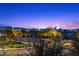 Beautiful Las Vegas city view at dusk from this meticulously landscaped neighborhood at 283 Grand Olympia Dr, Henderson, NV 89012