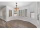 Inviting dining area with large windows and plantation shutters, adjacent to kitchen and living spaces at 283 Grand Olympia Dr, Henderson, NV 89012