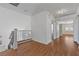 Well-lit hallway with wood floors provides easy access to other rooms of the house at 283 Grand Olympia Dr, Henderson, NV 89012