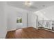 Well-lit hallway with wood floors provides easy access to other rooms of the house at 283 Grand Olympia Dr, Henderson, NV 89012