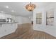 Open kitchen and dining area bathed in natural light, complete with modern appliances and stylish finishes at 283 Grand Olympia Dr, Henderson, NV 89012