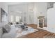 Bright living room with high ceilings, large windows, plush seating, and modern decor at 283 Grand Olympia Dr, Henderson, NV 89012