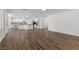 Expansive living area with wood floors, seamlessly connected to a modern kitchen, perfect for entertaining at 283 Grand Olympia Dr, Henderson, NV 89012