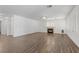 Spacious living room with a fireplace, wood floors, and shuttered windows offering ample natural light and a cozy ambiance at 283 Grand Olympia Dr, Henderson, NV 89012