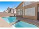 Sparkling pool with an attached jacuzzi and well-maintained pool deck, offering a serene backyard retreat at 283 Grand Olympia Dr, Henderson, NV 89012
