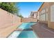Clear blue pool with an attached jacuzzi and a well-kept deck, providing a relaxing outdoor space at 283 Grand Olympia Dr, Henderson, NV 89012