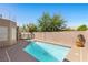 Refreshing pool and jacuzzi alongside a private patio with lush greenery, ideal for leisure and outdoor entertaining at 283 Grand Olympia Dr, Henderson, NV 89012