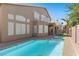 Beautiful pool, jacuzzi, balcony, and spiral staircase providing a luxurious outdoor experience at 283 Grand Olympia Dr, Henderson, NV 89012
