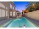 Inviting backyard pool and spa offer a refreshing escape in a private setting with a spiral staircase at 283 Grand Olympia Dr, Henderson, NV 89012