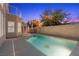 Inviting backyard pool at dusk, complete with spa and patio at 283 Grand Olympia Dr, Henderson, NV 89012