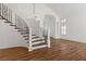 Wrought iron staircase with wood-look floors at 283 Grand Olympia Dr, Henderson, NV 89012